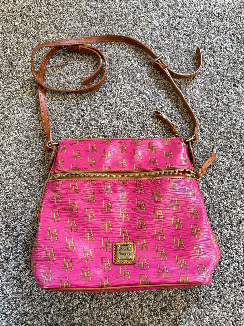 Dooney & Bourke 1975 Hot Pink Signature Crossbody with Brown Leather Strap.